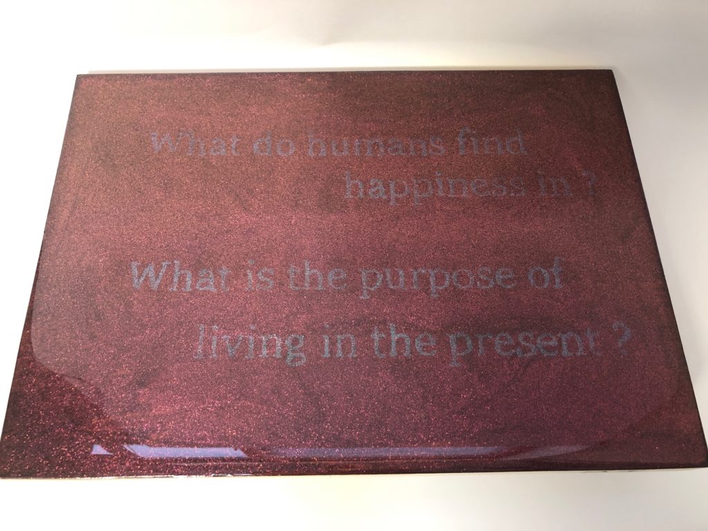 Artwork asking what humans find happiness in and the purpose of living in the present